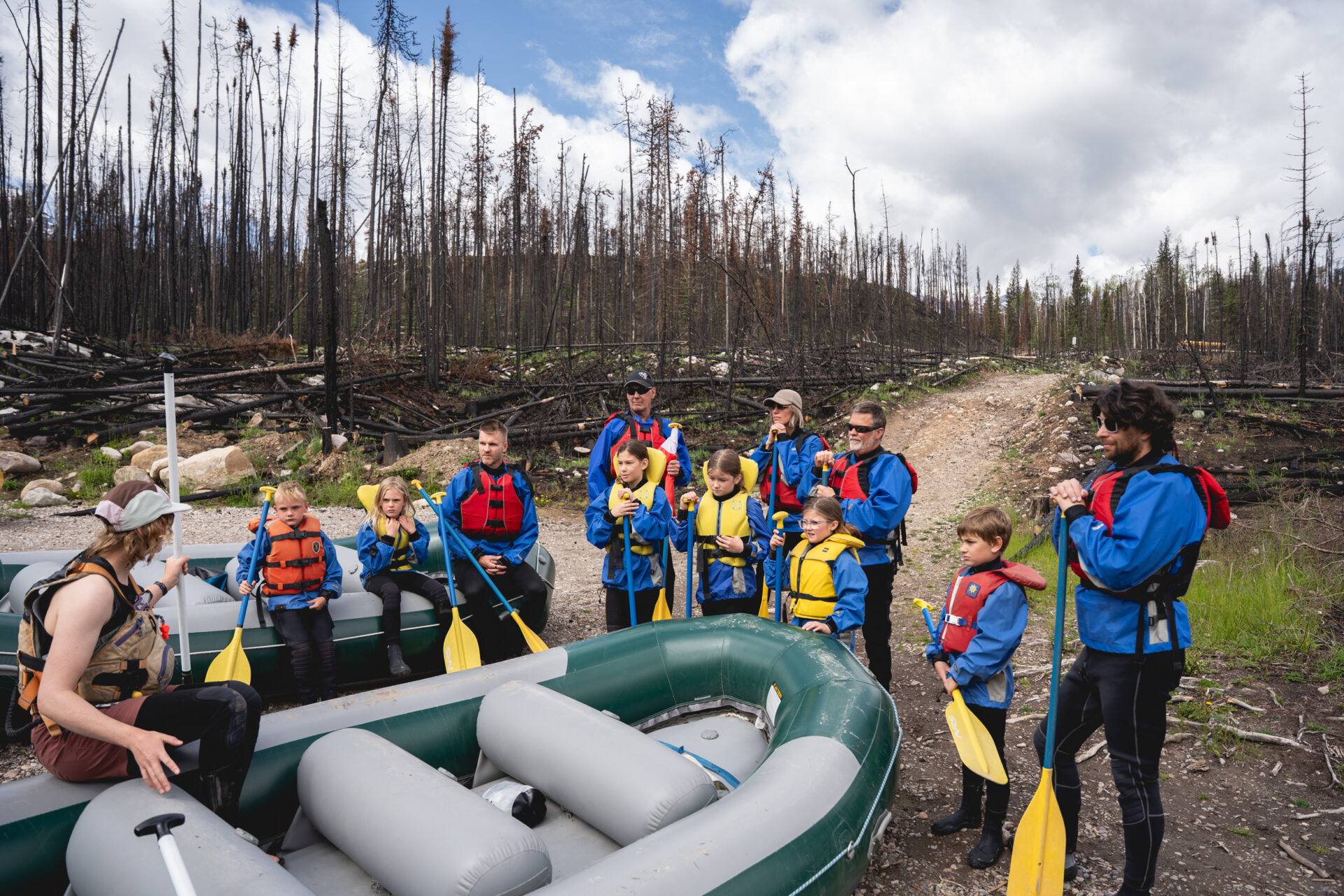 group getting safety instructions from a raft guide at jasper rafting